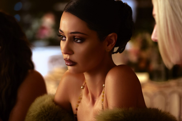 Actress Alexa Demie sits at a table as Maddy in Euphoria in episode 3.