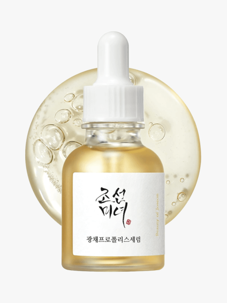 Glow Serum Propolis and Niacinamide Hydrating Facial Soothing Moisturizer in branded clear bottle with white pipette on light gray background