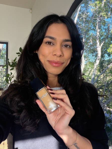 Image may contain Black Hair Hair Person Face Head Bottle Cosmetics and Perfume